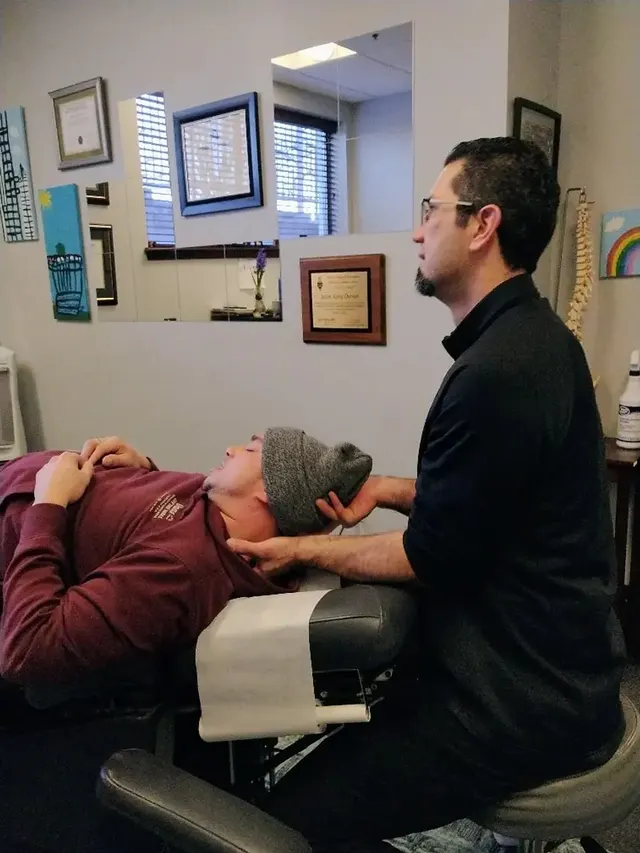 Dr. Durnas working with a patient on the treatment table