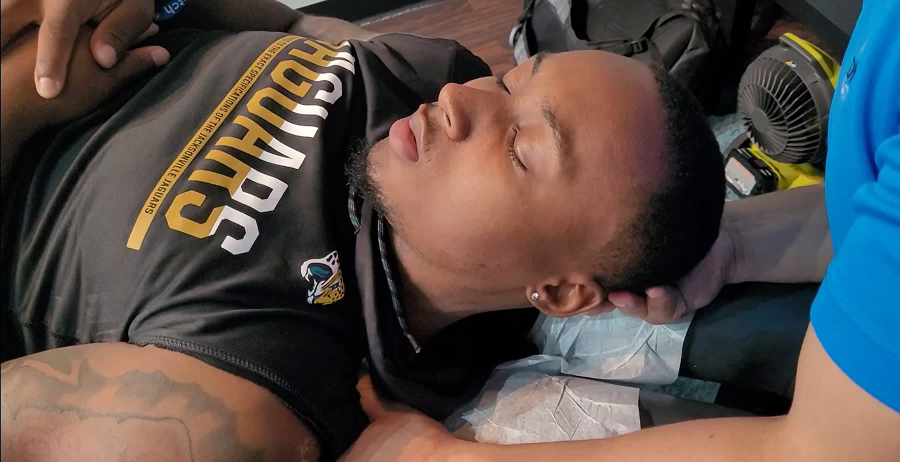 Hands-on cervical work with an athlete on the table