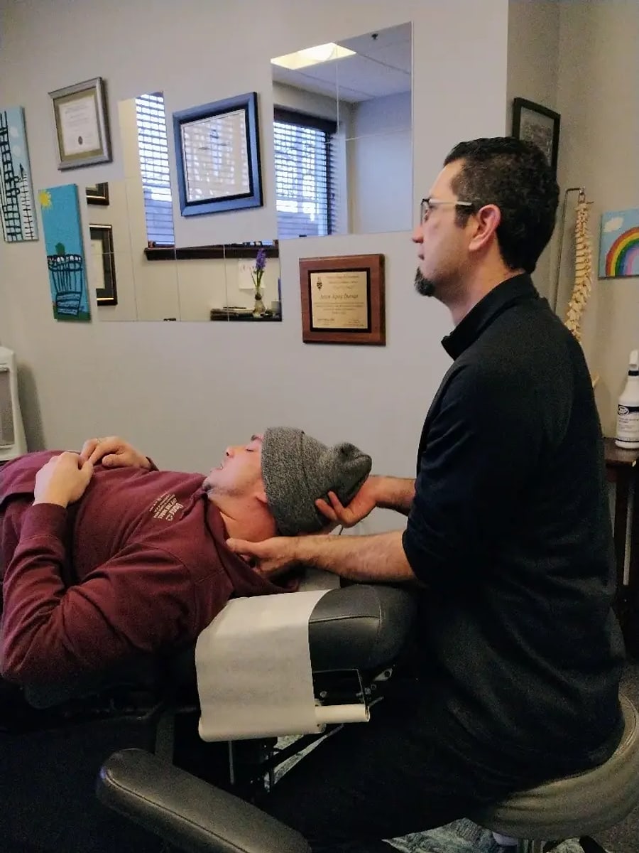 Dr. Durnas working with a patient on the treatment table